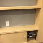 Hiding unsightly water meter with built-in shelving unit and sliding cabinet doors for access (MDF)