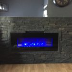Built In Bookshelves Converted to Faux Stone Fireplace