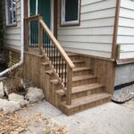 After- Stairs platform and skirting around front of house