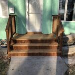 After- Mint house with round details in platform with stairs and railings